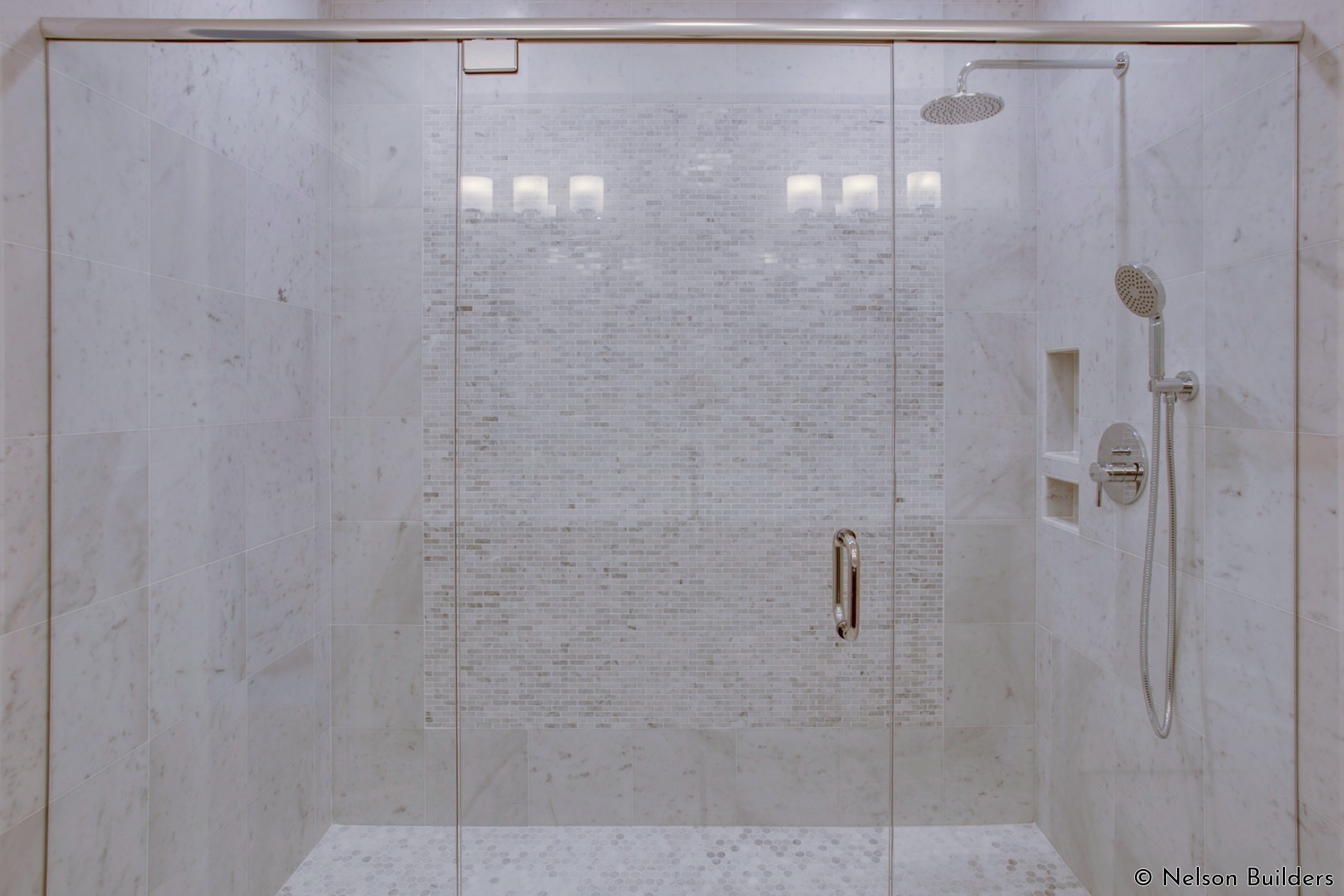 The beautiful, Carrara covered master bath and shower of this new Cherrydale plan by Nelson Builders.