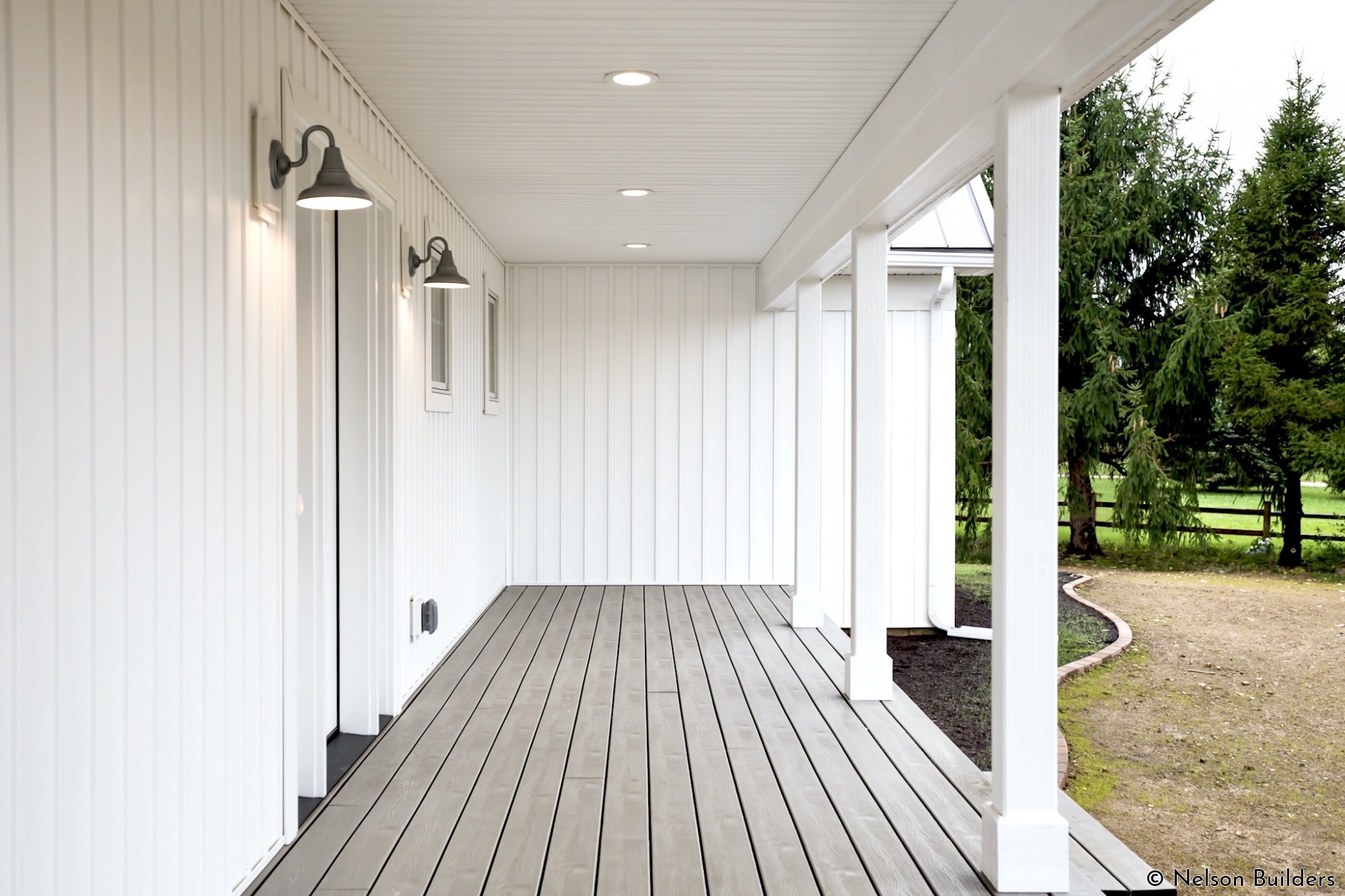 Sticking with the nature of the original home, the new farmhouse has a large wrap around deck to greet guests.