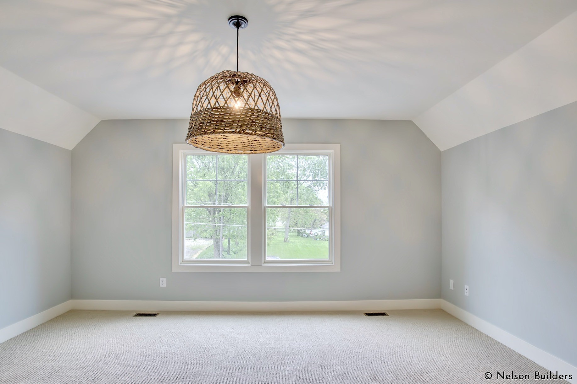 The bonus room is accented with a basket chandelier, for a little touch of character.