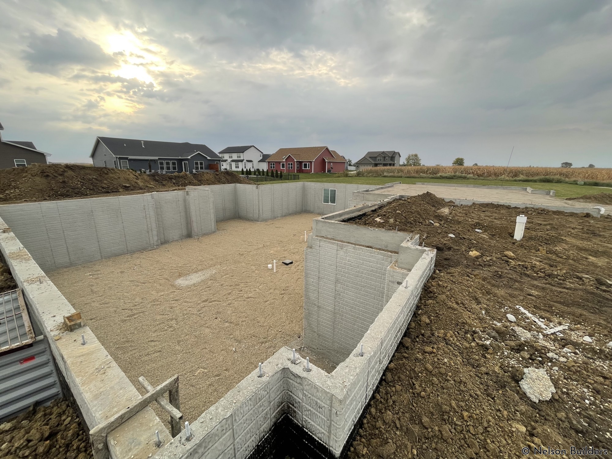 Backfilled with rock, waiting for the rains to pass before pouring this week.